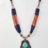 Multi-strand ethnic Tibetan necklace featuring lapis lazuli and coral beads with a Hamsa-style turquoise and coral inlay pendant