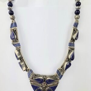 Tibetan tribal or Nepalese style necklace featuring white metal (also known as Tibetan silver) and blue lapis lazuli (or imitation) stones